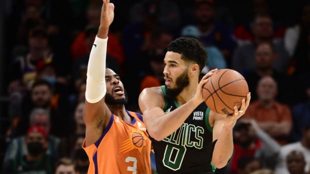 Dec 10, 2021; Phoenix, Arizona, USA; Phoenix Suns guard Chris Paul (3) guards Boston Celtics forward Jayson Tatum (0) during the second half at Footprint Center. Mandatory Credit: Joe Camporeale-USA TODAY Sports